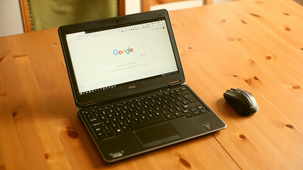 Black Dell laptop with Google homepage