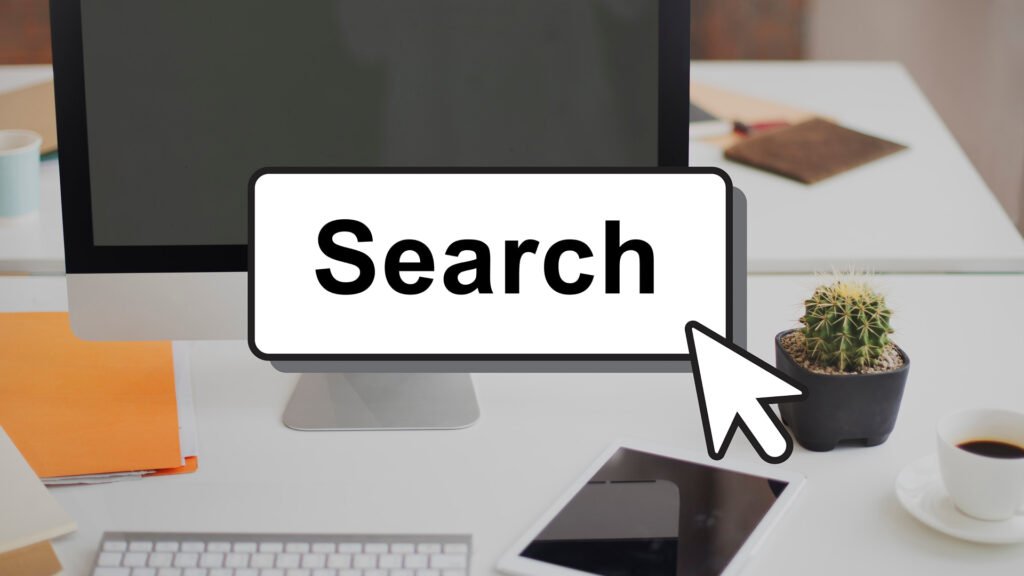 Search button with cursor on modern office desk setup, representing online search, keyword research, and SEO optimization concept